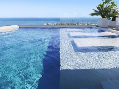 An Exceptional Duplex Penthouse with Sweeping Views Moments from the Beach