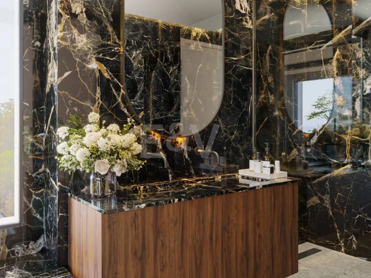 An Exceptional Duplex Penthouse with Sweeping Views Moments from the Beach