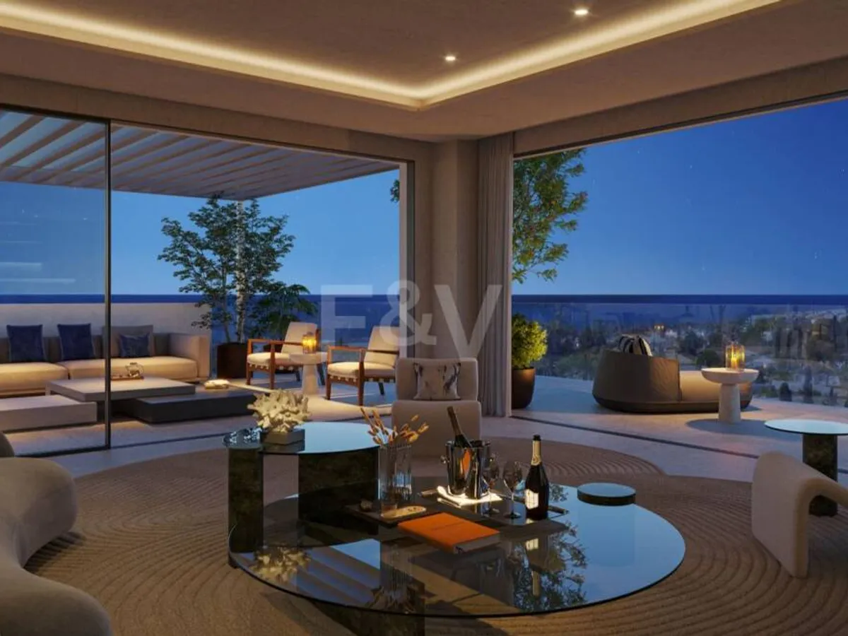 An Exceptional Duplex Penthouse with Sweeping Views Moments from the Beach