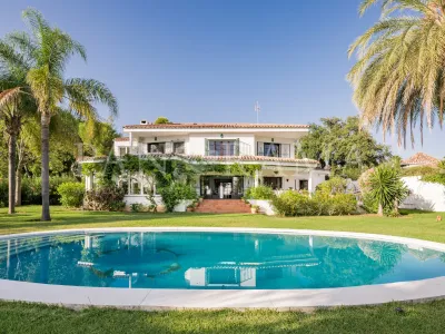Charming family villa with sea and mountain views, lush garden and serene poolside next to Marbella town