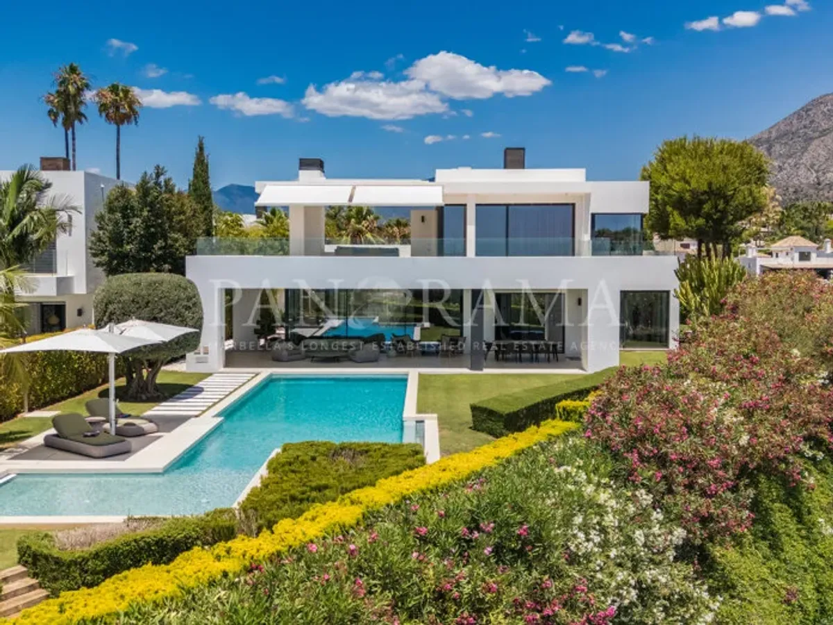 Charming family villa with sea and mountain views, lush garden and serene poolside next to Marbella town