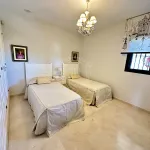 Elegant Two-Bedroom Apartment with Panoramic Golf Views in Guadalmina Alta 13